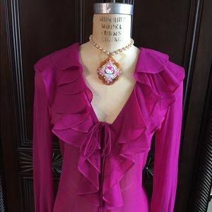 Women’s crepe fuchsia blouse with ruffles.